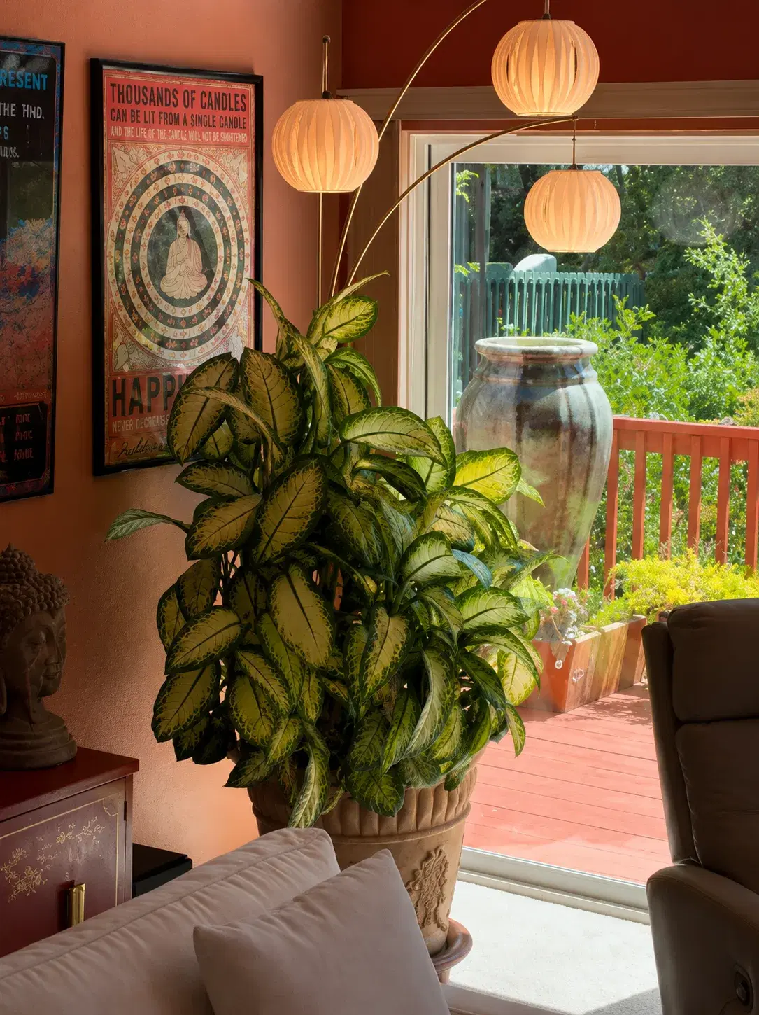 Warm lights, plants, and meaningful art in a living space